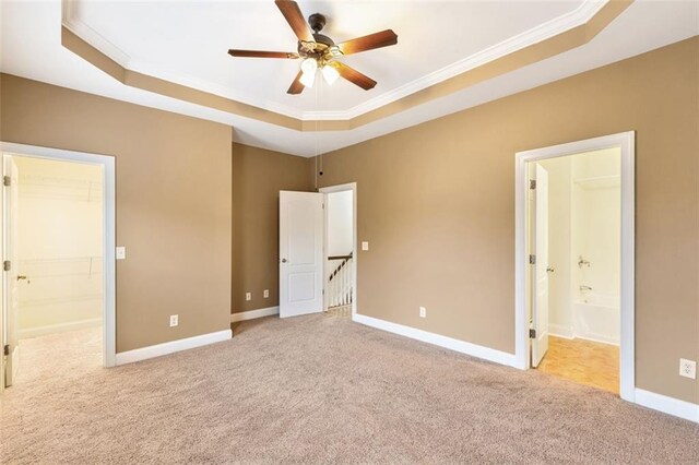 275 Blue Pointe Ct, Suwanee, GA 30024 - carpeted empty room with a tray ceiling, crown molding, a ceiling fan, and baseboards