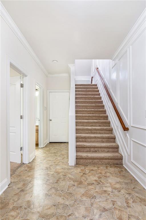 275 Blue Pointe Ct, Suwanee, GA 30024 - spare room featuring light colored carpet, a ceiling fan, and baseboards