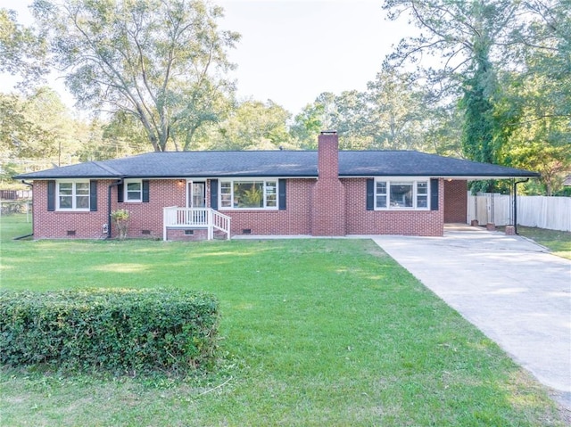 ranch-style house with a front yard and a carport