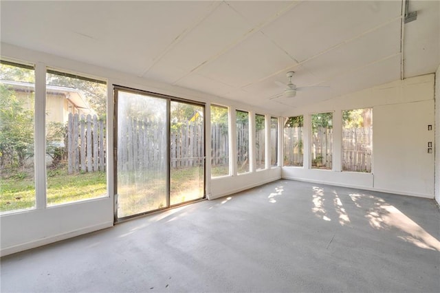 unfurnished sunroom featuring ceiling fan and lofted ceiling