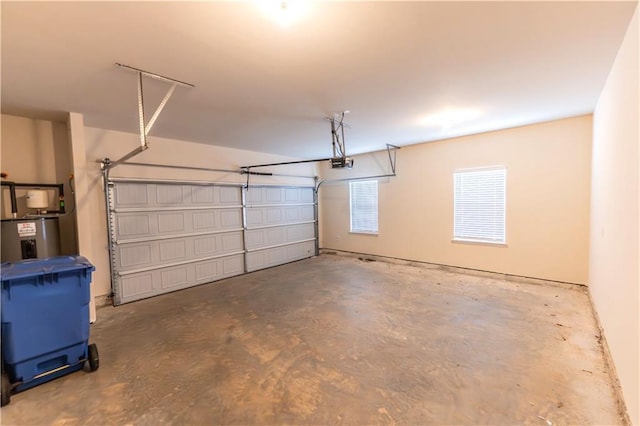 garage with a garage door opener and water heater