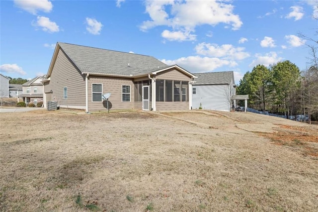 rear view of property featuring central AC unit and a sunroom