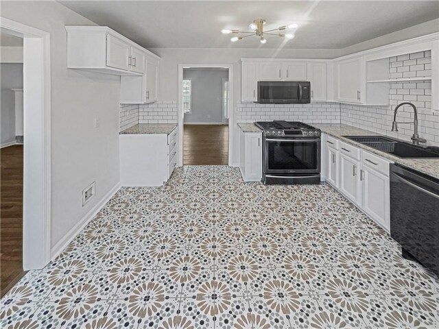 31 Mariner Way SE, Acworth, GA 30102 - kitchen with stainless steel appliances, light floors, a sink, and white cabinets
