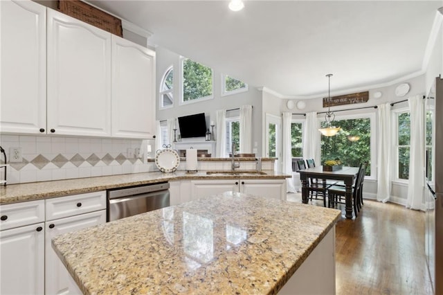 2713 Misty Rock Cv, Dacula, GA 30019 - kitchen with dishwasher, tasteful backsplash, wood finished floors, white cabinetry, and light stone countertops