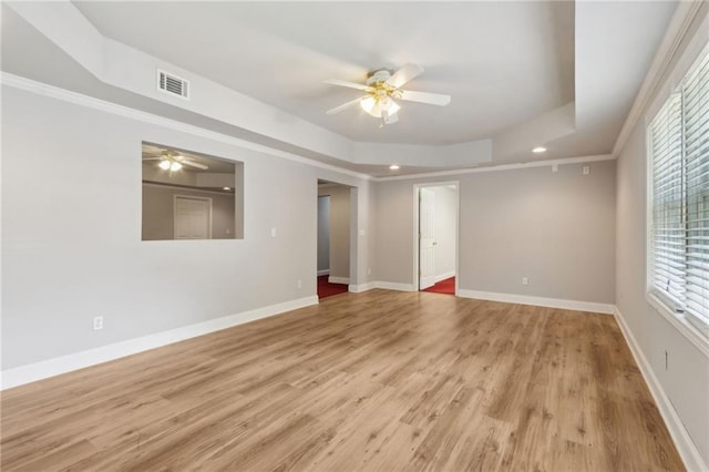 2713 Misty Rock Cv, Dacula, GA 30019 - empty room featuring a ceiling fan, a tray ceiling, wood finished floors, recessed lighting, and ornamental molding