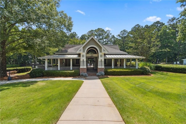 2713 Misty Rock Cv, Dacula, GA 30019 - view of front of property featuring a porch and a front lawn