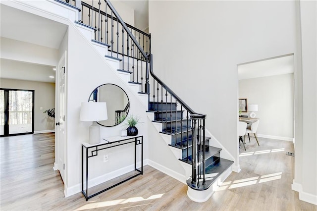 stairway with hardwood / wood-style floors