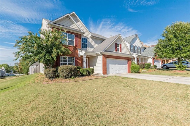 view of front of property with a garage and a front lawn