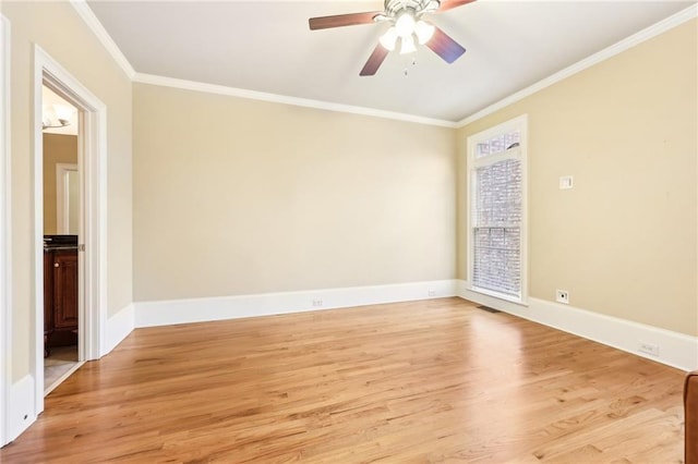 spare room featuring ceiling fan, ornamental molding, and light hardwood / wood-style flooring