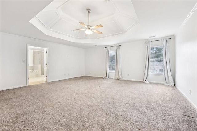 carpeted spare room featuring ceiling fan and ornamental molding