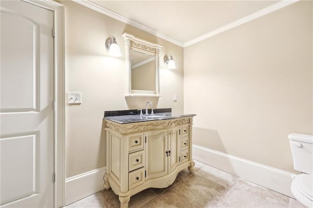 bathroom featuring crown molding, vanity, and toilet