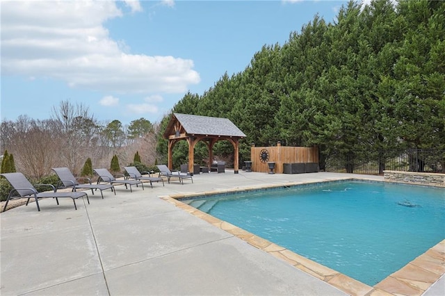 view of swimming pool featuring a gazebo and a patio area