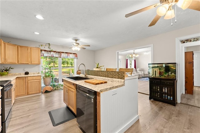 kitchen with light brown cabinets, sink, light hardwood / wood-style flooring, and black appliances