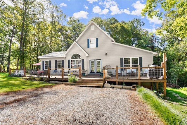 back of property featuring a wooden deck