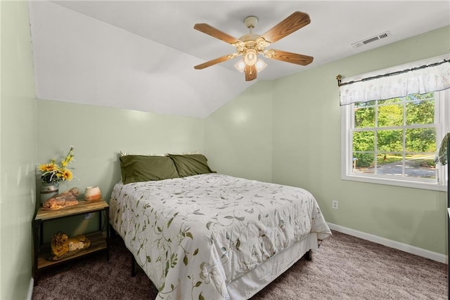 bedroom with vaulted ceiling, ceiling fan, and carpet