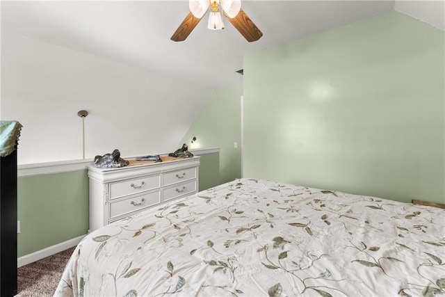 bedroom featuring vaulted ceiling, ceiling fan, and carpet floors