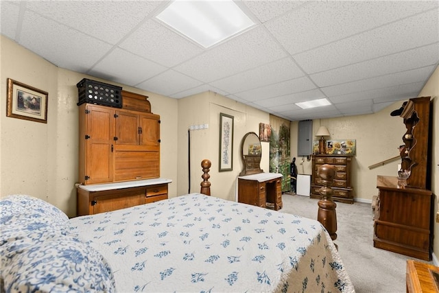 carpeted bedroom with a paneled ceiling