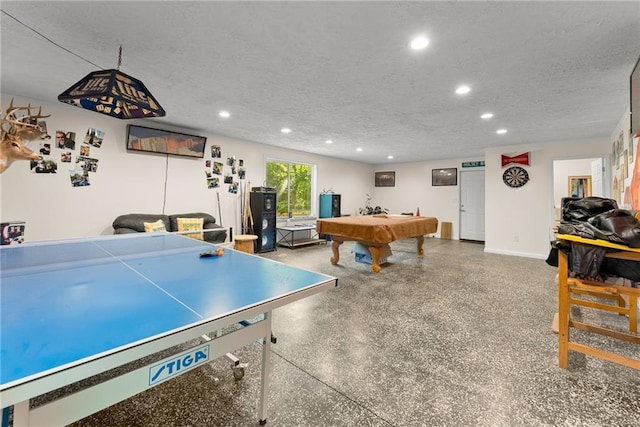 recreation room with a textured ceiling and billiards