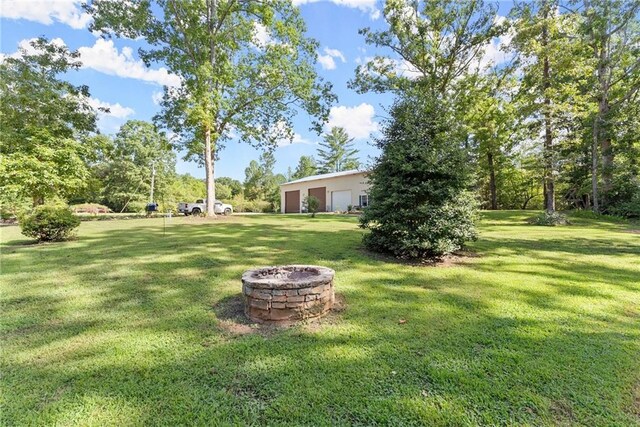 view of yard featuring a fire pit