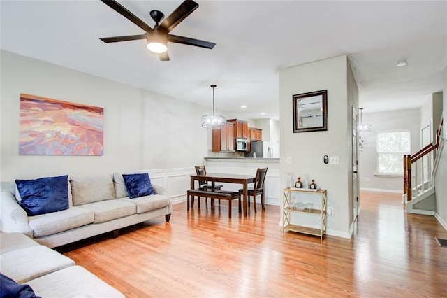 3622 Utoy Dr, South Fulton, GA 30331 - living area featuring a ceiling fan, light wood-type flooring, and stairs