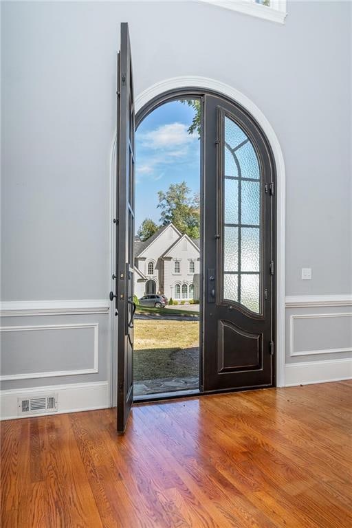 entryway with wood-type flooring