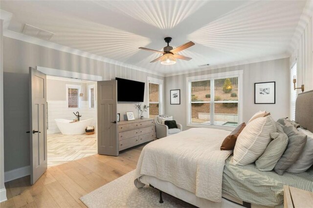 811 Walnut River Trl, Hoschton, GA 30548 - bedroom with ceiling fan, multiple windows, light wood finished floors, and ensuite bath