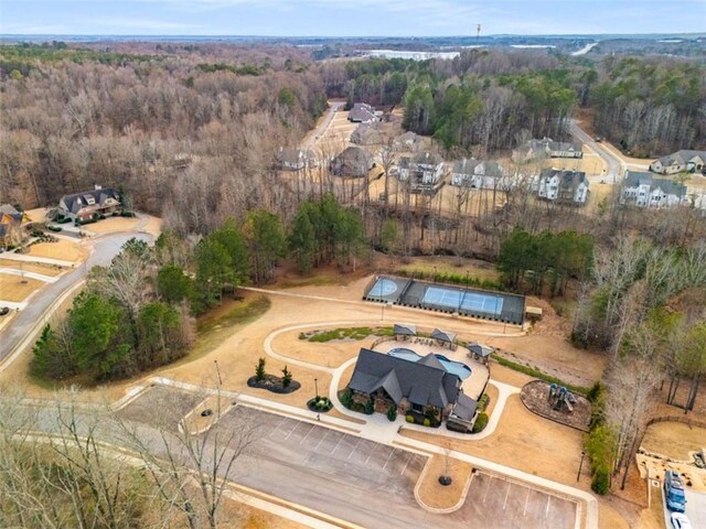 811 Walnut River Trl, Hoschton, GA 30548 - birds eye view of property with a wooded view