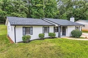 ranch-style home with a front yard