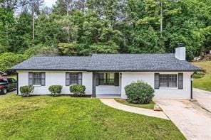 ranch-style home with a front yard