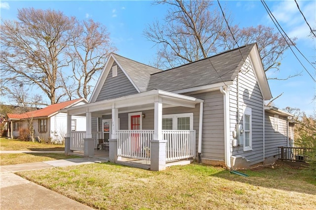 bungalow-style home featuring a porch and a front lawn