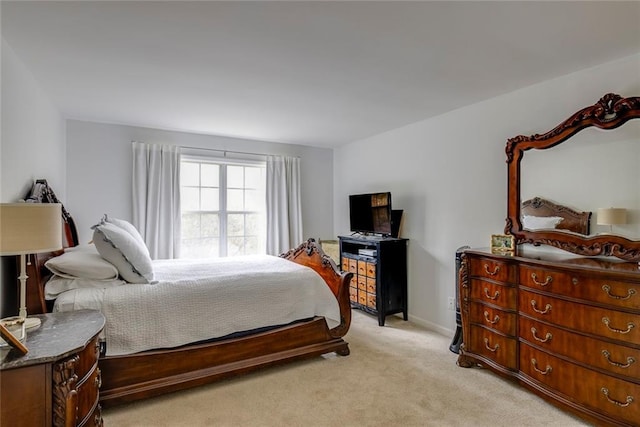 bedroom featuring light carpet