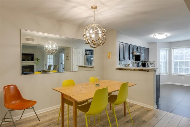 dining space with an inviting chandelier