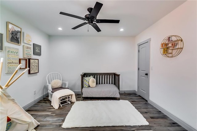 bedroom with recessed lighting, baseboards, and wood finished floors