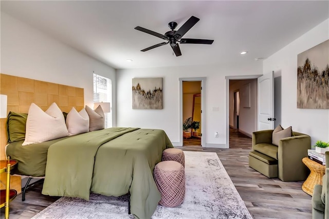 bedroom with recessed lighting, baseboards, wood finished floors, and ceiling fan