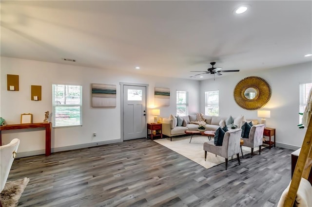 living area featuring wood finished floors, plenty of natural light, and recessed lighting