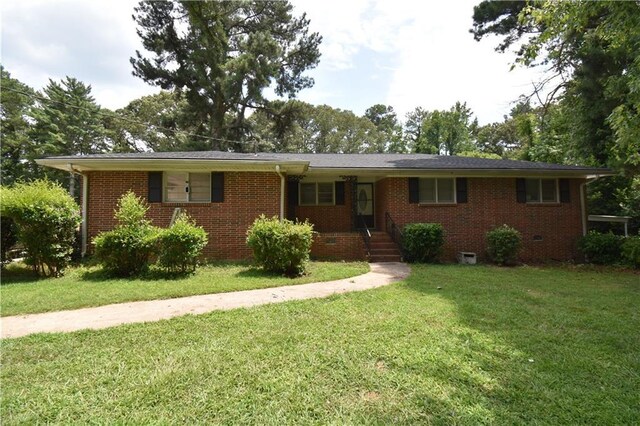 ranch-style house with a front lawn