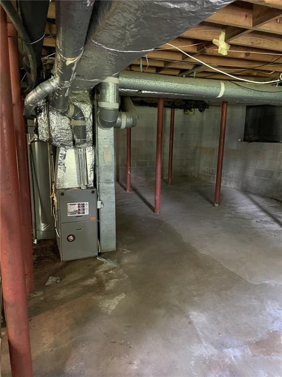 basement with heating unit and gas water heater