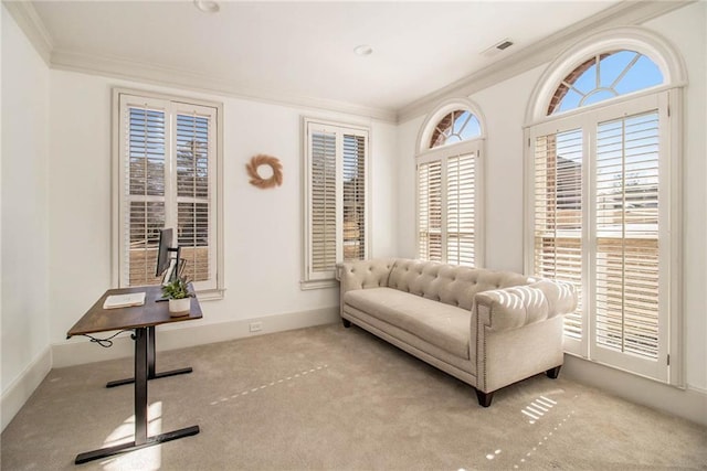 living area featuring light carpet and ornamental molding