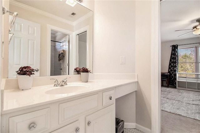 bathroom with vanity, crown molding, ceiling fan, and walk in shower