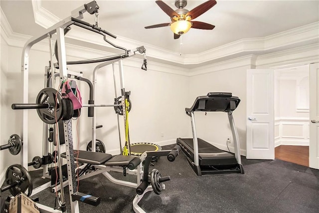 exercise room with ornamental molding and ceiling fan