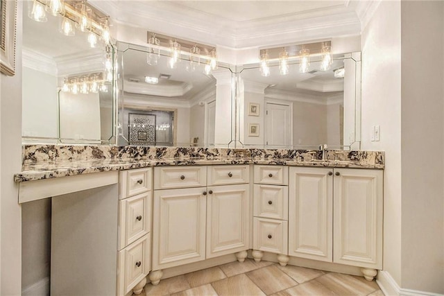 bathroom with vanity and ornamental molding