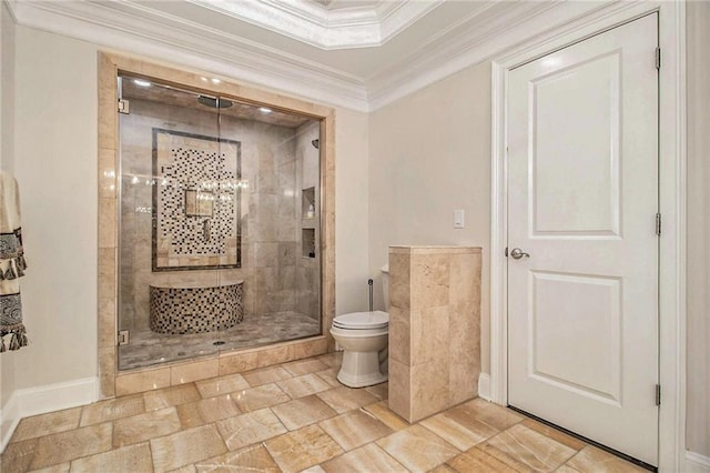 bathroom with ornamental molding, toilet, and a shower with shower door