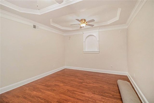 unfurnished room featuring hardwood / wood-style flooring, ornamental molding, and ceiling fan