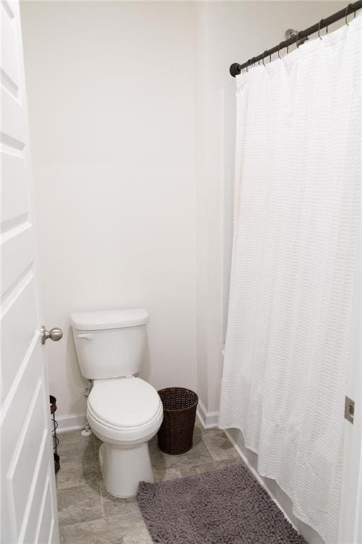2159 Redfern Rd, Dacula, GA 30019 - full bath with baseboards and toilet