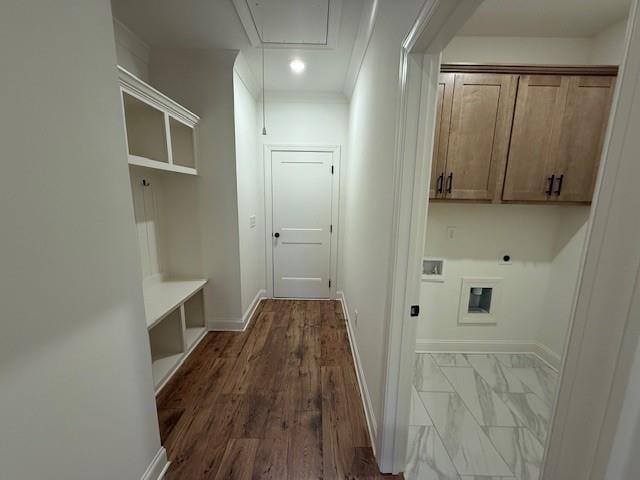 clothes washing area with baseboards, cabinet space, electric dryer hookup, and attic access