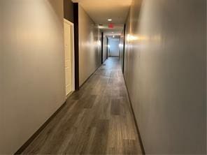 hallway featuring dark hardwood / wood-style floors