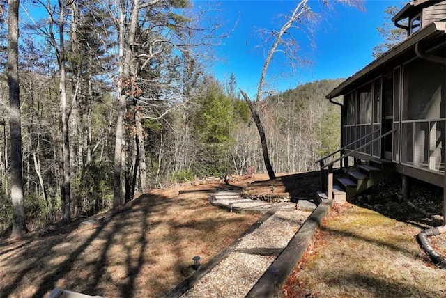 view of yard with a sunroom