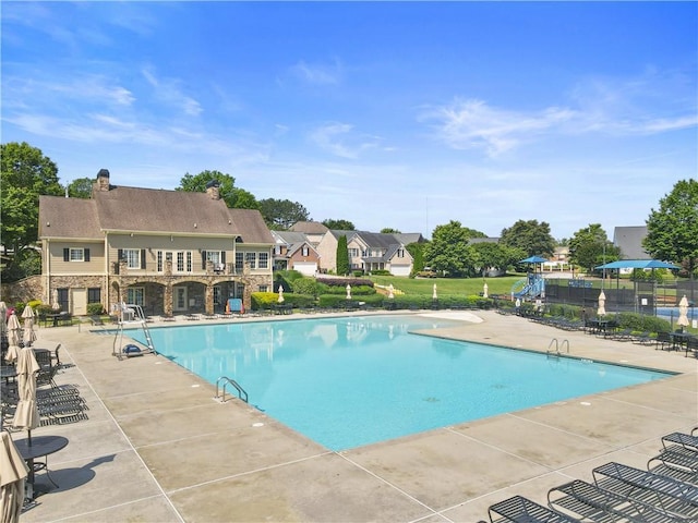 7261 Silk Tree Pointe, Braselton, GA 30517 - community pool featuring a patio and a residential view