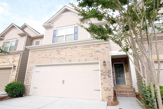 view of front facade featuring a garage, brick siding, and concrete driveway