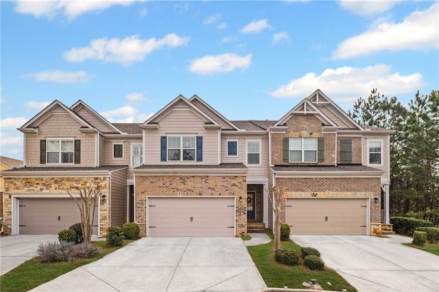 view of front of home featuring brick siding, driveway, and a garage